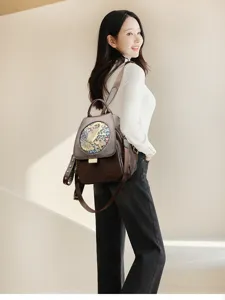 Women's leather embossed backpack, stylish multi-functional travel & commute daypack.