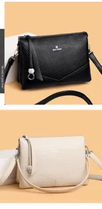 Élégant sac à bandoulière pour femme en cuir texturé, grand sac porté épaule tendance.