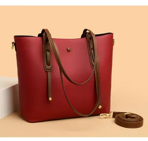 Large capacity red tote bag for women, stylish PU leather shoulder handbag with brown handles.