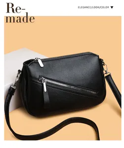 Classic black litchi pattern soft leather crossbody bag with stylish diagonal zipper design.