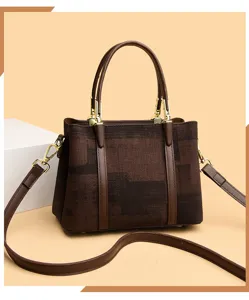 Close-up detail of the brown retro geometric textured shoulder bag, showing refined gold hardware.