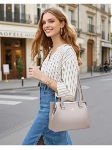 Stylish women's messenger handbag with metal frame closure, elegant gray design for daily wear.
