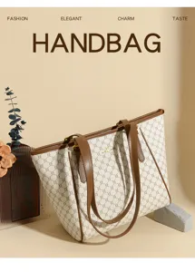 Detailed view of the elegant monogram tote bag with brown leather handles, large capacity.