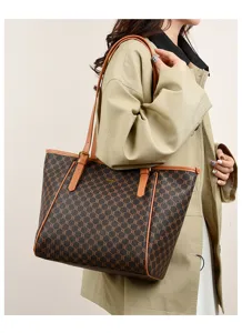 Brown monogram leather trim shoulder tote bag detail view, large capacity commuter bag.