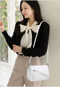 Minimalist soft leather crossbody shoulder bag for women, stylish daily commuting handbag.