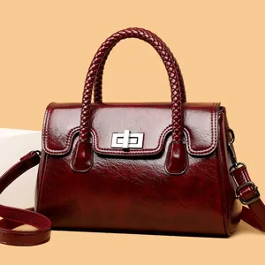Sac à main femme rétro en cuir rouge de luxe avec poignée tressée et fermoir chic
