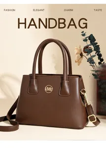 Stylish brown leather handbag for women, large capacity commuter tote bag with gold metal logo.