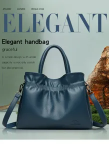 Elegant dark blue leather shoulder bag with ample capacity, stylish handbag for daily use.