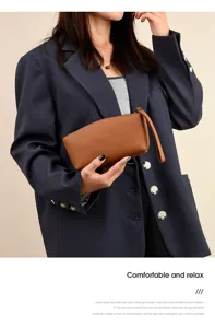 Sac pochette en cuir véritable pour femmes, élégant portefeuille marron minimaliste avec dragonne.
