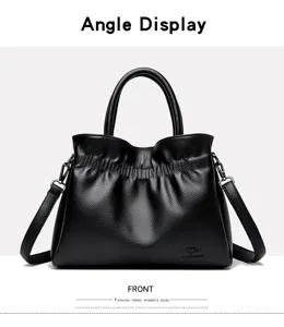 Black leather pleated handbag detail showcasing front angle with dual handles and strap.
