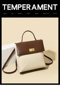 Minimalist two-tone women backpack with metal turn-lock closure and top handle detail.