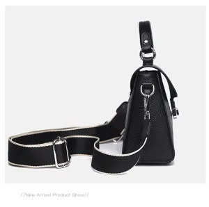 Classic black leather top-handle handbag with adjustable woven strap for women daily use.