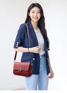 Stylish women's leather crossbody bag with elegant design, perfect for daily casual wear and outings.