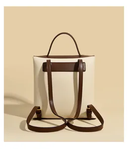 Detailed view of stylish women leather backpack in cream white and brown chic design.
