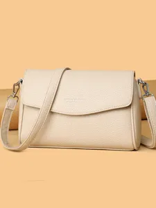 Borsa a tracolla in pelle beige da donna, piccola borsa a spalla elegante con cinghia.
