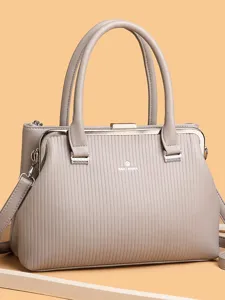 Elegant kiss-lock shoulder bag for women, large capacity fashion tote and handbag for daily use.