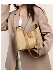 Minimalist leather bucket bag with contrast color design, stylish women commuter shoulder bag.