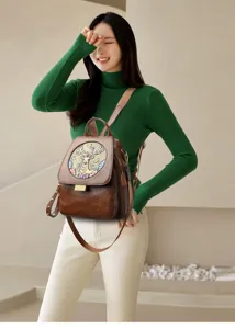 Women leather backpack with embossed deer design, versatile travel commuting school bag.