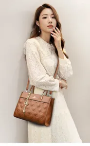 Chic brown quilted leather tote bag for women featuring elegant chain pendant and classic design.
