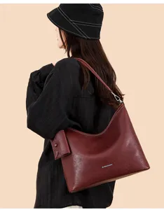 Large capacity wine red shoulder bag, stylish casual hobo tote with pouch for women commuting daily.