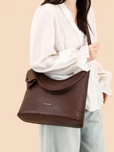 Minimalist large capacity shoulder bag for women, stylish brown leather hobo commute bag.