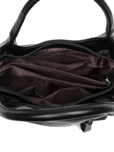 Spacious black soft leather tote bag with multiple zipper compartments, ideal for daily commute.