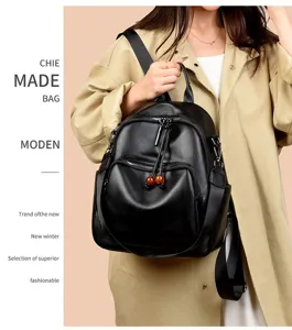 Women's black soft leather backpack daily casual stylish travel bag with zipper and tassel.