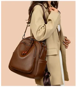 Women's brown soft leather backpack fashion versatile shoulder bag casual anti-theft daypack.