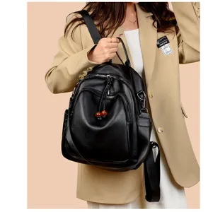 Stylish black soft leather backpack for women, large capacity anti-theft design chic.