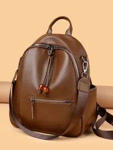 Brown soft leather women backpack, stylish casual daypack with spacious main compartment.