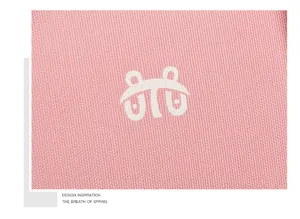 Insulated lunch bag pink fabric detail with cute graphic print, portable meal prep bag.