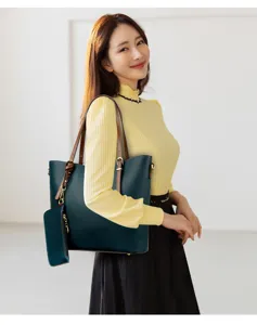 Spacious dark green leather tote bag with matching pouch, stylish casual shoulder handbag for women.