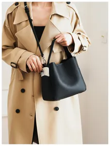 Elegant black pebbled leather bucket bag for women, versatile crossbody and shoulder handbag.