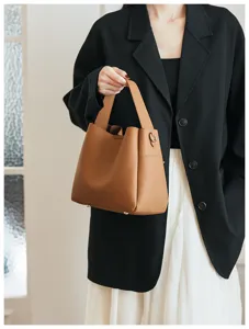 Detailed showcase of the stylish brown soft leather bucket handbag with elegant design.