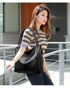 Stylish black leather tote shoulder bag for women, large capacity casual daily handbag.