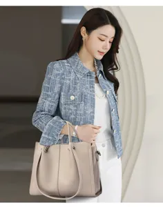 Detailed view of women's soft leather tote bag, elegant style for daily business commute.