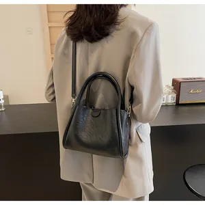 Black soft PU leather shoulder crossbody handbag, casual daily style with metal hardware details.