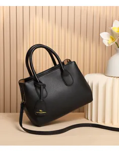 Black litchi pattern leather handbag, casual commuter tote with adjustable strap.