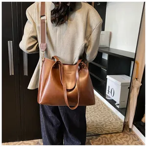Women's large capacity brown PU leather shoulder bag, casual tote handbag for daily use.