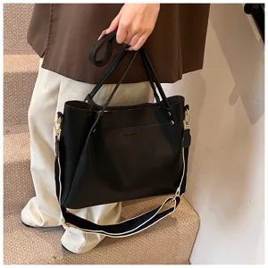 Casual women's black PU leather tote handbag, large capacity daily shoulder bucket bag.