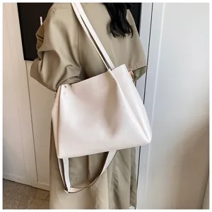 Detail shot of stylish white leather shoulder tote bag, showing strap and texture, daily wear.