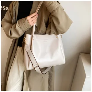 Detailed shot of women's PU leather shoulder bag with wide strap and spacious daily design.
