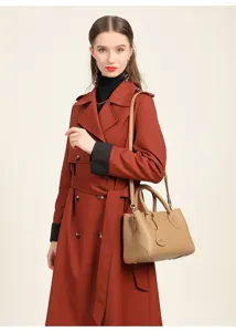 Detail view of stylish pebbled leather crossbody handbag with an adjustable strap.