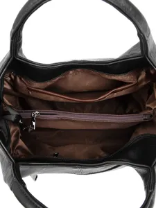 Vintage black synthetic leather commuter tote bag interior view with multiple compartments.
