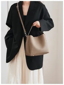 Detailed view of the soft leather bucket bag, showing fine texture and structured design.