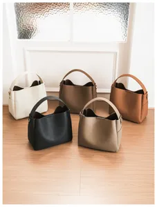 Five soft leather bucket bags in diverse colors, ideal for daily shoulder and crossbody use.