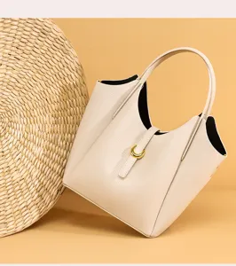 Elegant genuine leather bucket handbag for women, premium litchi grain cowhide tote bag.