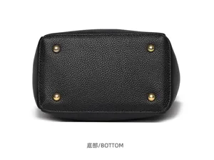 Genuine leather bucket bag bottom detail, black lychee pattern with metal feet. New.
