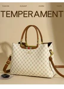 Chic monogram tote handbag with structured top handles and detachable shoulder strap for daily commute.