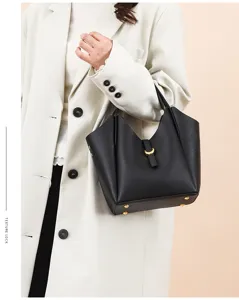 Genuine leather bucket bag for women, stylish minimalist shoulder tote with metal lock.